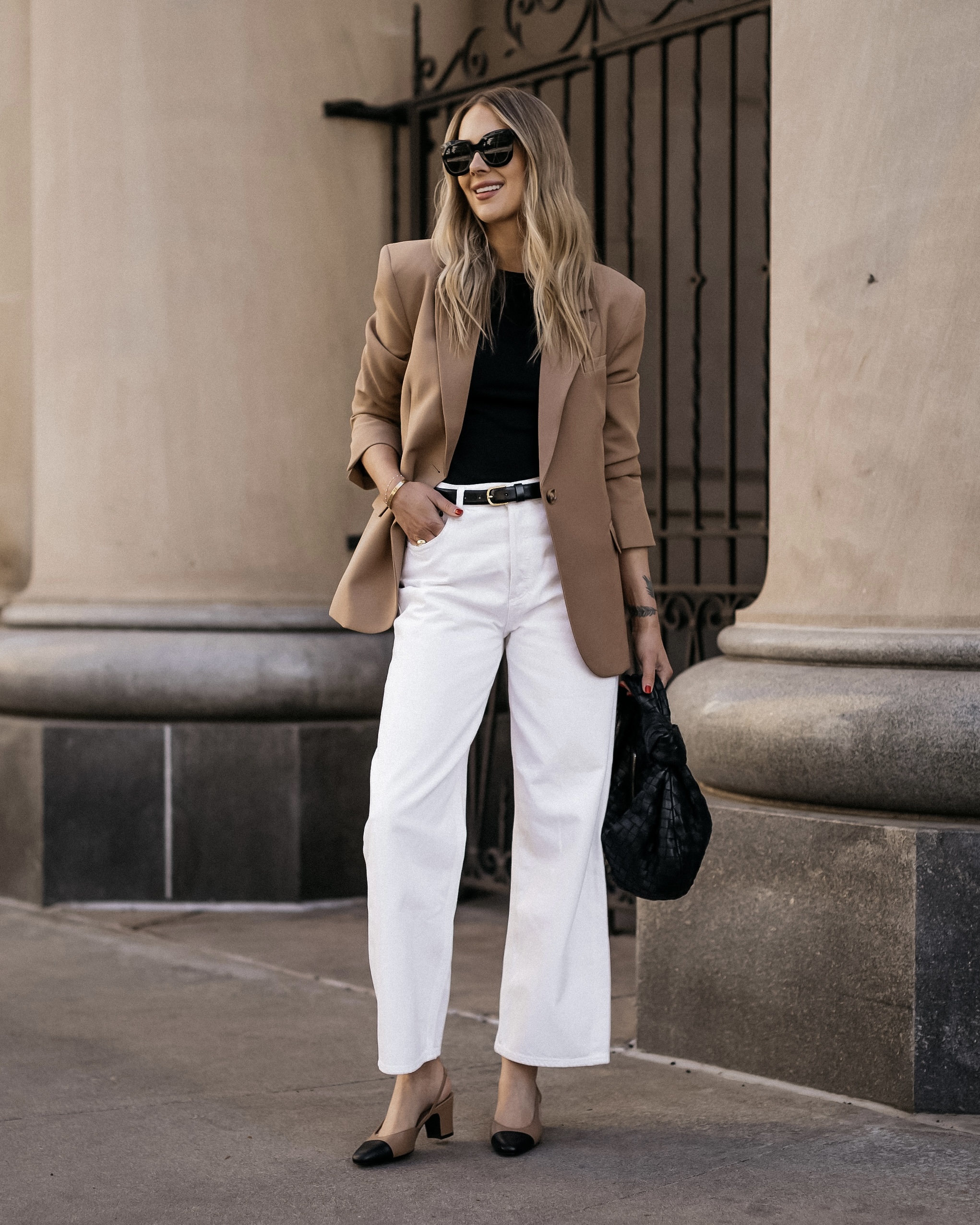 Camel blazer and white trousers in a warm neutral palette